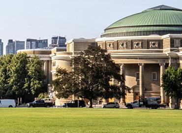 A view of U of T&amp;#039;s convocation hall from the lawn in front of it