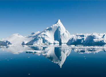 an iceberg floating in the ocean