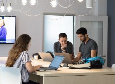 students working in common study space