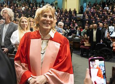 Jane Corkin receiving her U of T honorary in Convocation Hall