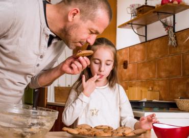 A family smelling cookies. 