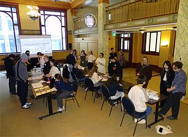 A large group pf people in a room including art history students and Ontario Heritage Trust staff.