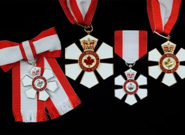 Four red and white medals.