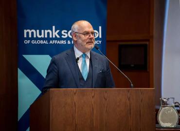 Estonian President Alar Karis delivering remarks from a podium