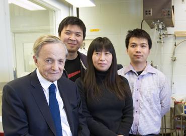 John Polanyi with three members of his research group. 