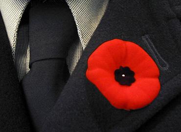 A poppy on a man&amp;#039;s lapel