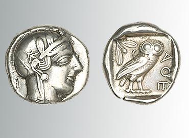 Two coins, the left coin has a profile of a face and the coin on the right has an image of an owl.