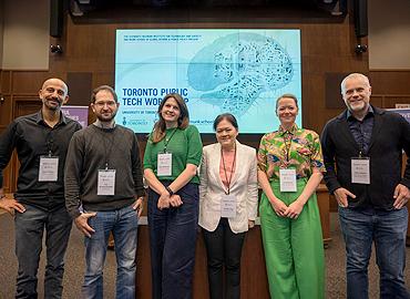 6 people posing on a stage