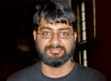 Headshot of Shami Ghosh.