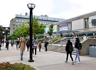 Students walking in front of Sid Smith Hall