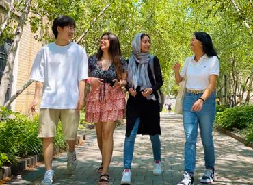 A group of students walking outside.