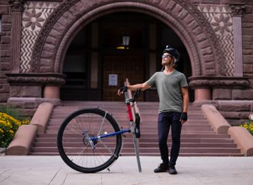 Taylor Stark poses with his unicycle at U of T