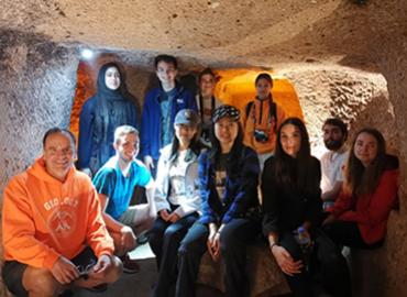 Students and professor in a cave