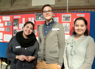 Paulina Salira, Alice Stanton-Hagan and Myra Wein in front of their poster