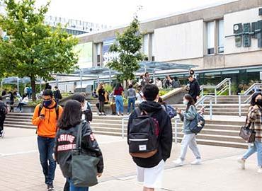 Students walking outside of Sid Smith Hall