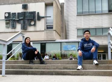 Veronica Bergstrom and Andrew Yin in front of Sidney Smith Hall