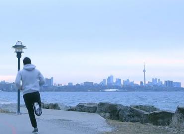 Person jogging around Lake Ontario.