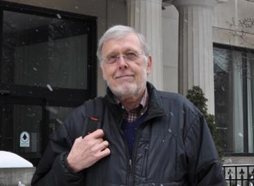 Wayne Sumner in front of the Jackman Humanities Building