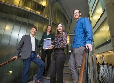 Group photo of the Winterlight Labs team standing on a staircase