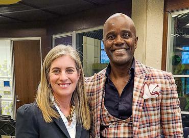 Wes Hall standing with Dean Melanie Woodin