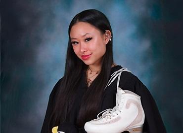  Xin Yi Lim in a black gown with figure skates over her shoulder