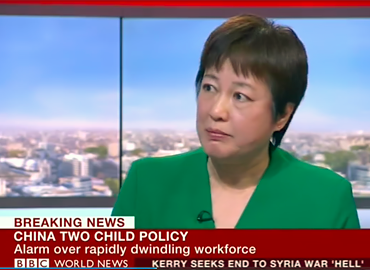 Yuwen Wu on tv with the words &amp;quot;breaking news&amp;quot; as the subtext.