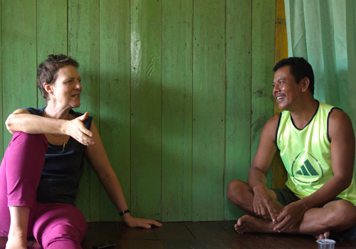 Tania Li talks with a plantation worker