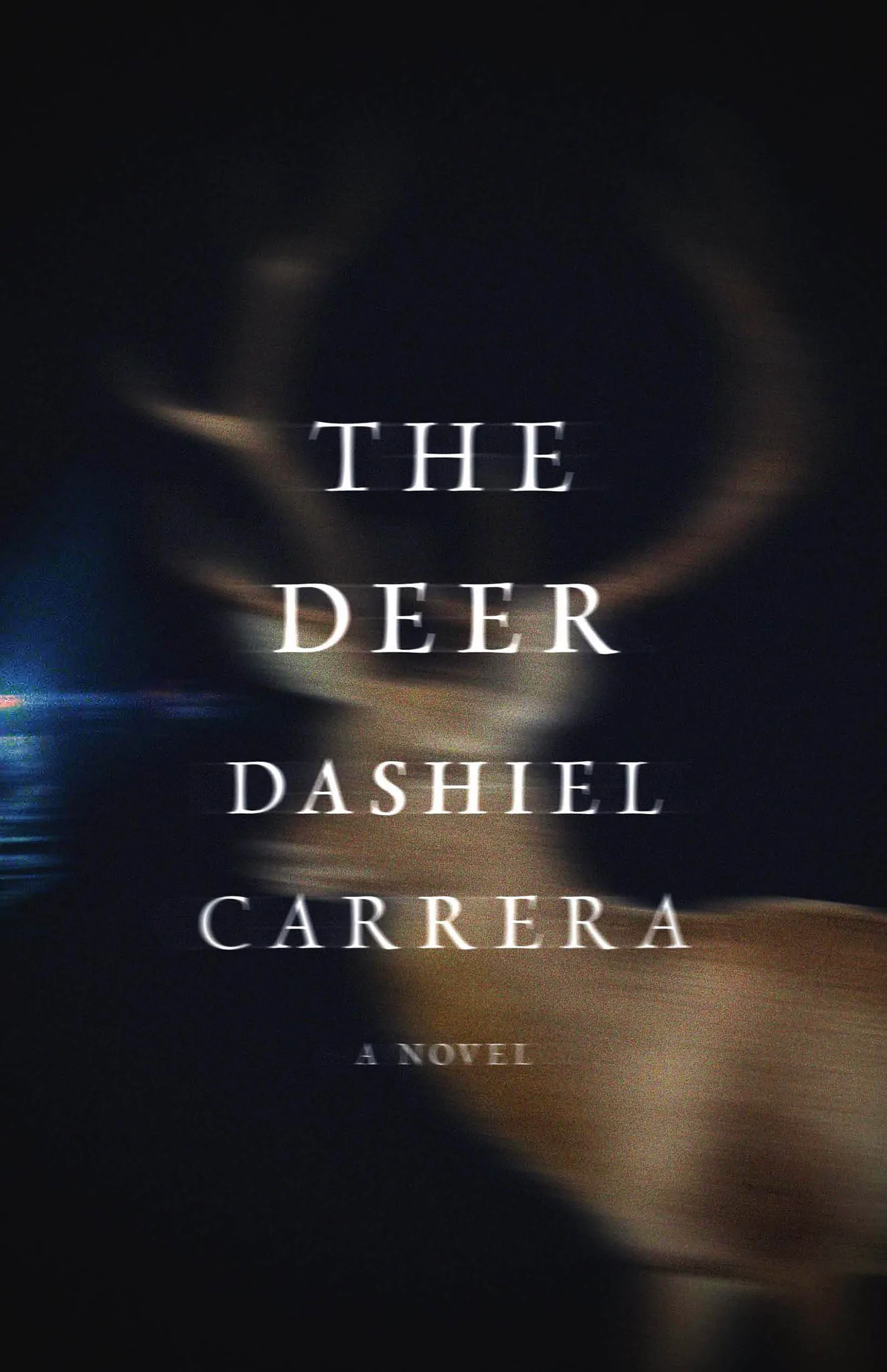 Book cover with title, "The Deer," Image of deer in headlights on cover.
