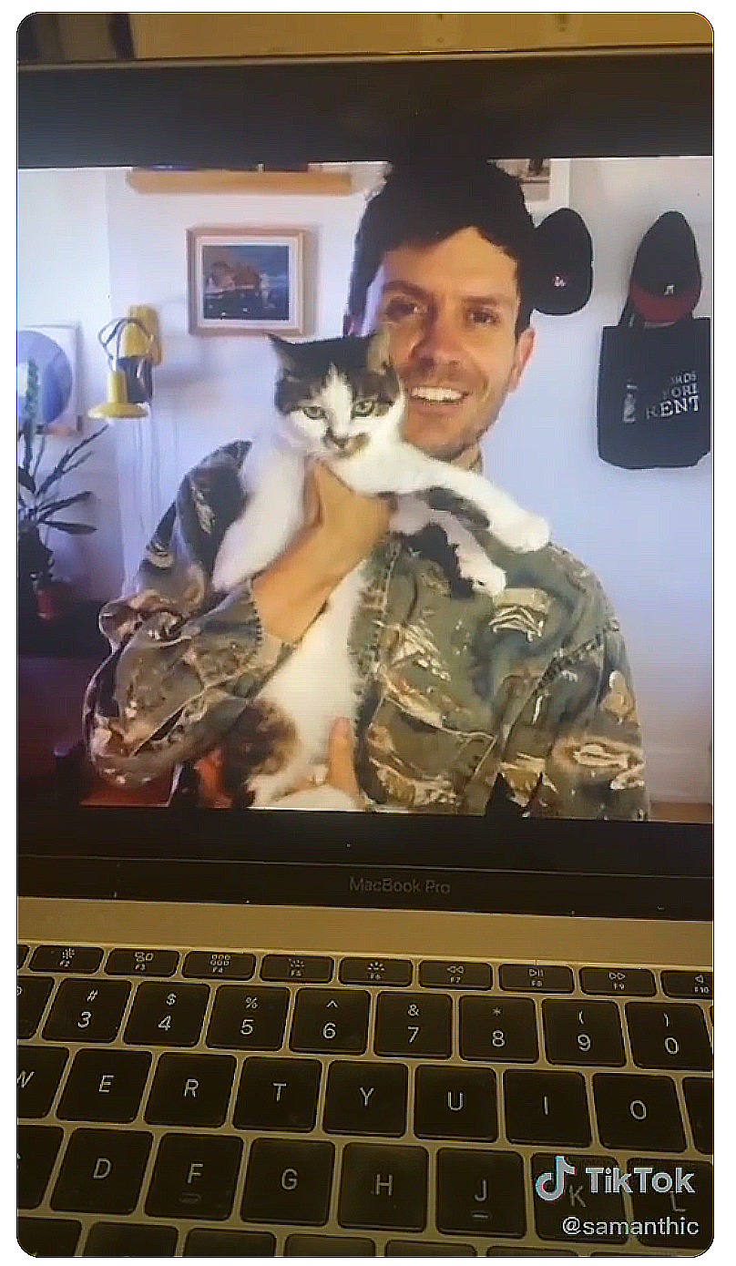 Adam Hammond’s holding his cat.