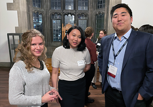 Two attendees to the standing next to Matthew Oh (right) is a policy advisor with the Government of Ontario.