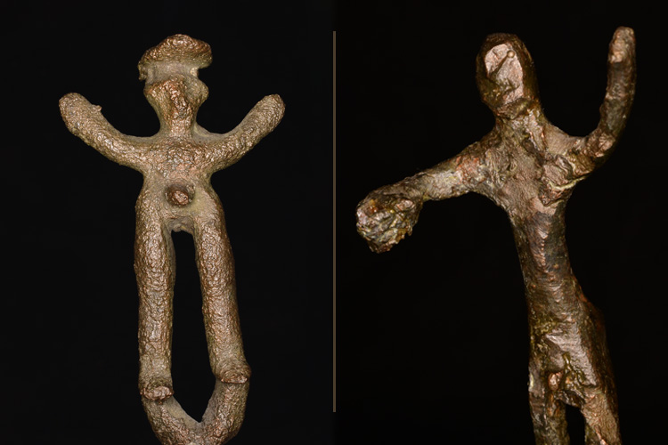 Two roughly-crafted bronze figurines 