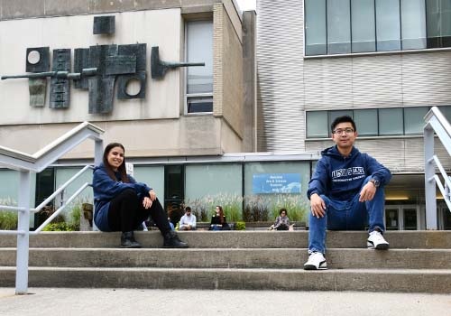 Veronica Bergstrom and Andrew Yin in front of Sidney Smith Hall