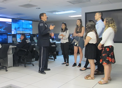 ICM students listen to a presentation by an officer of the Mexican Federal Police