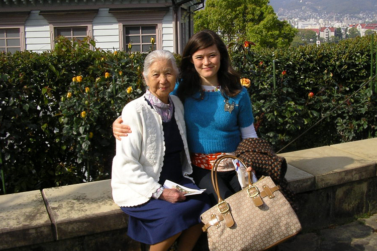 Grandma (Hisa) and Lara Okihiro standing outside.