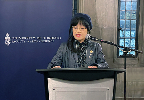 Vivian Lo speaking at a podium. 
