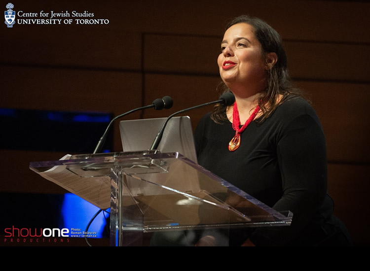 Anna Shternshis speaking at a podium