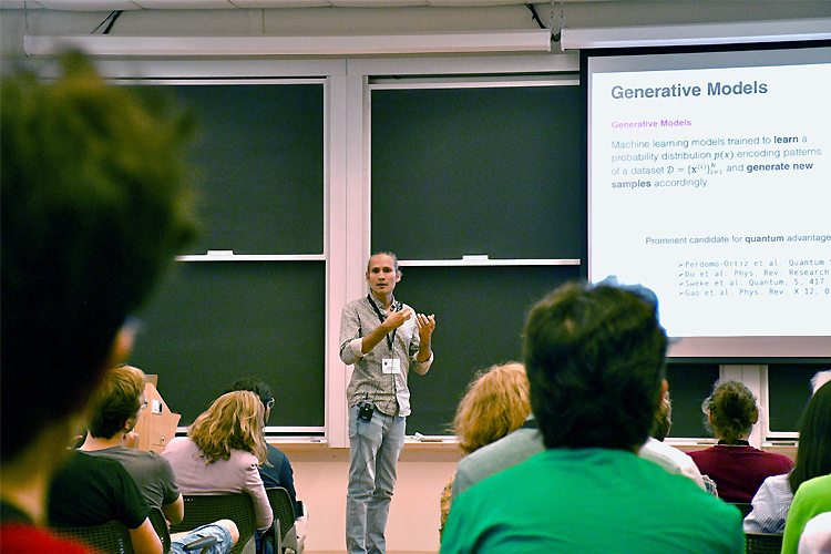 A man in front of a classroom presenting